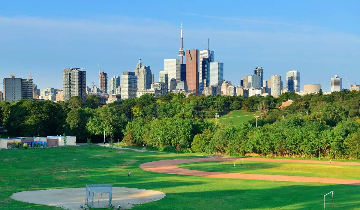 toronto skyline against a manicured lawn