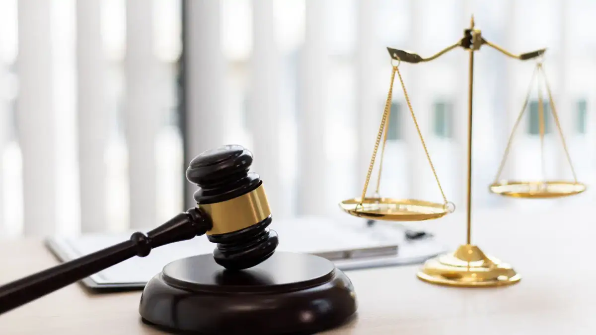 judge's gavel and scales of justice on a desk