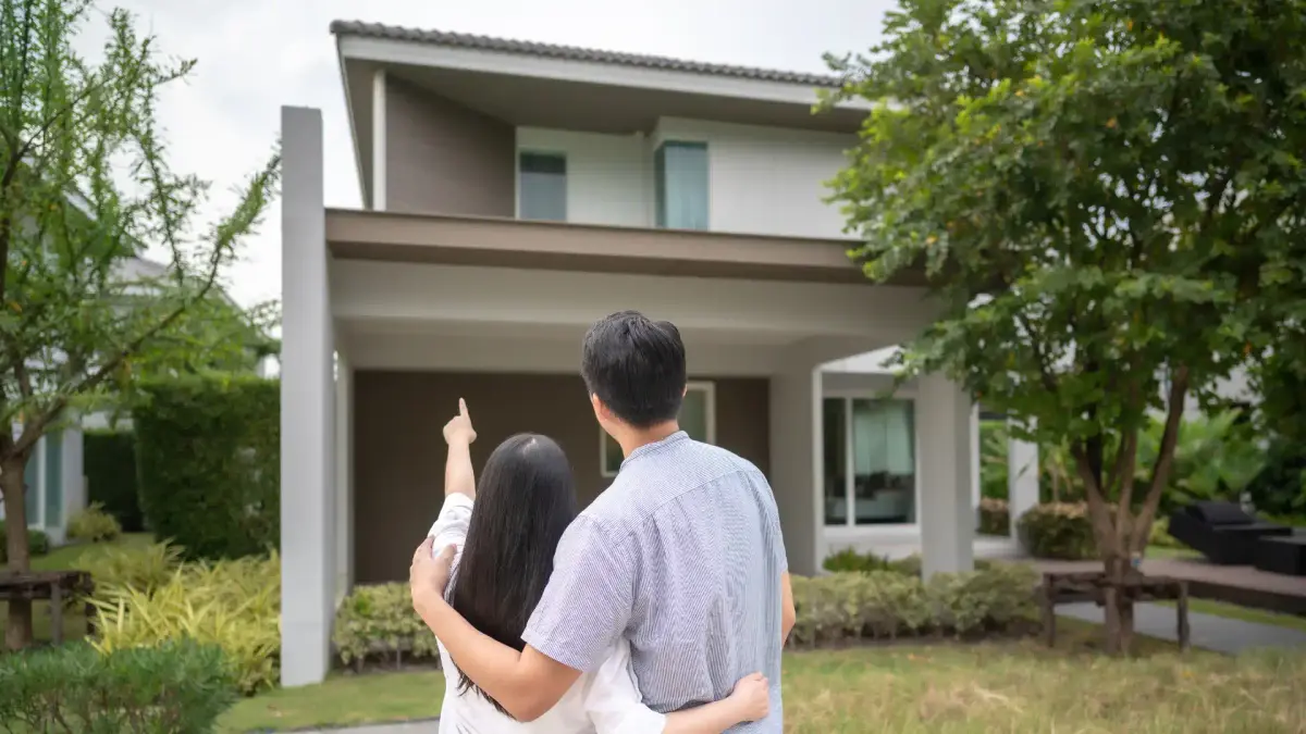 a couple looking at a pre-construction house