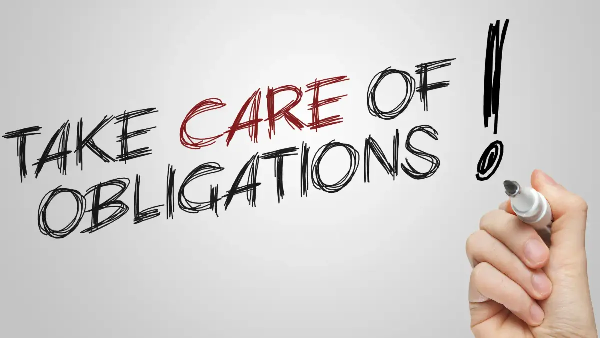 "take care of obligations written!" written by a hand holding a marker pen
