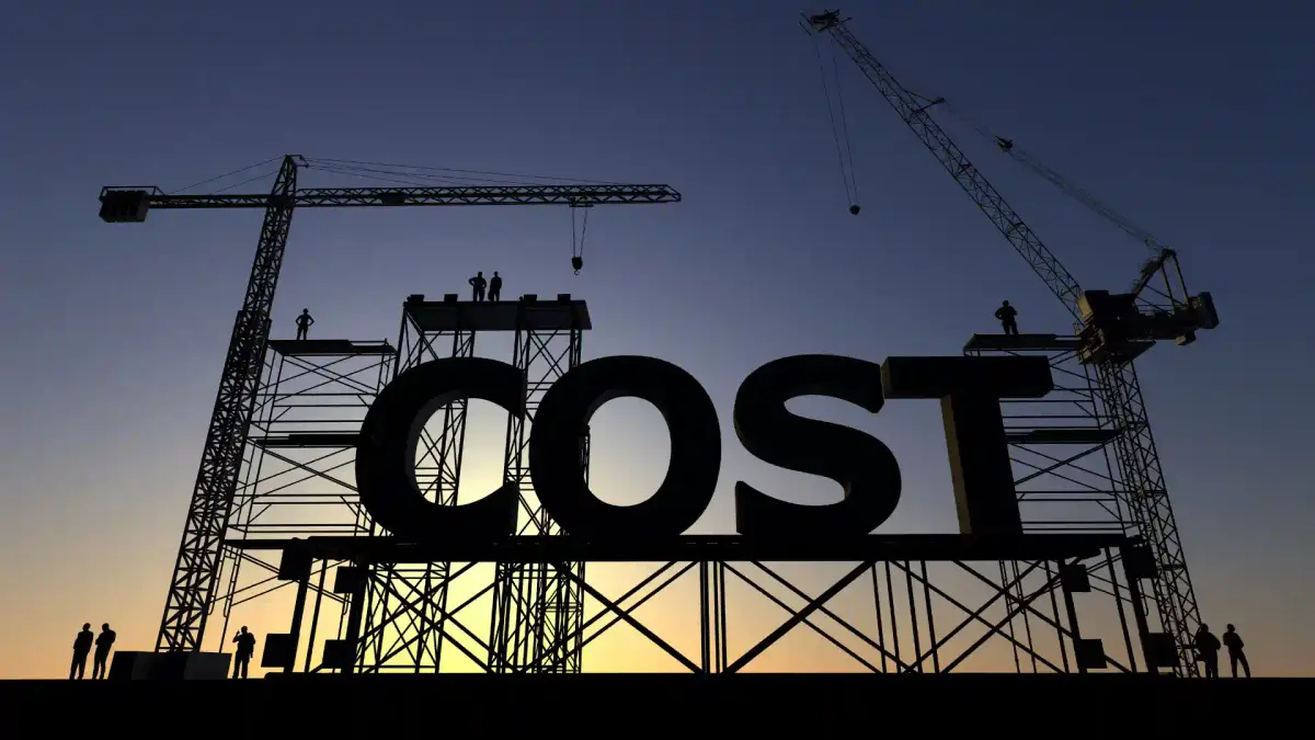 The word COST written on a silhouette of a construction site