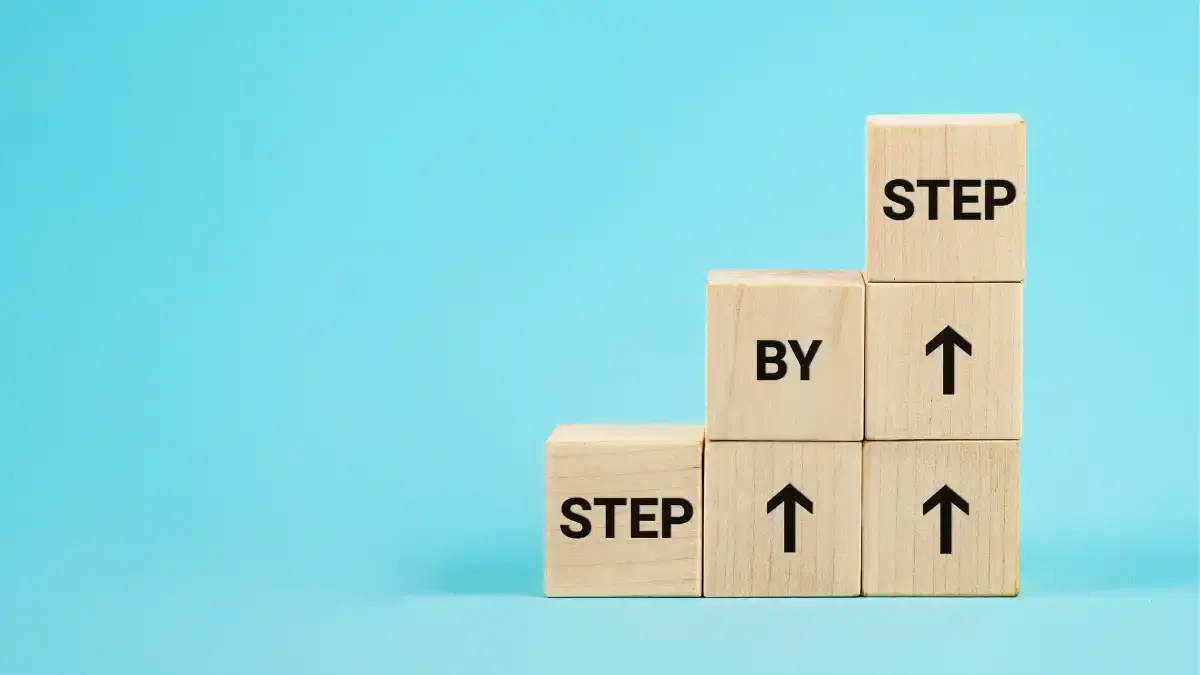 step by step written on wooden blocks
