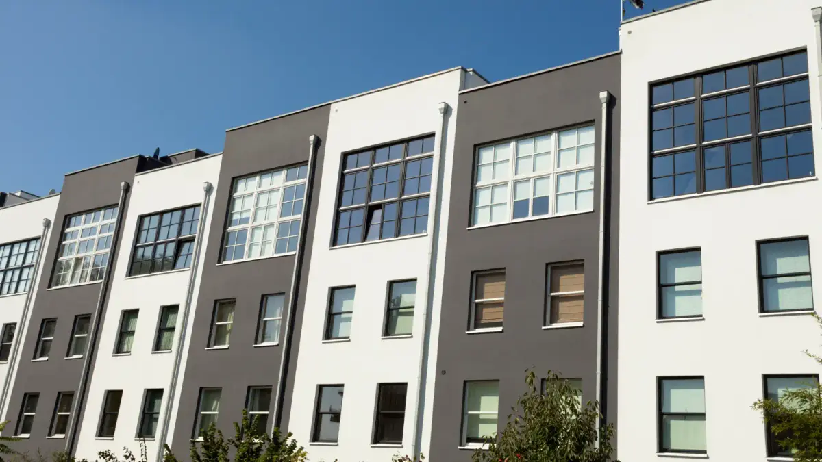 Matt black and white siding on stacked townhouse condos